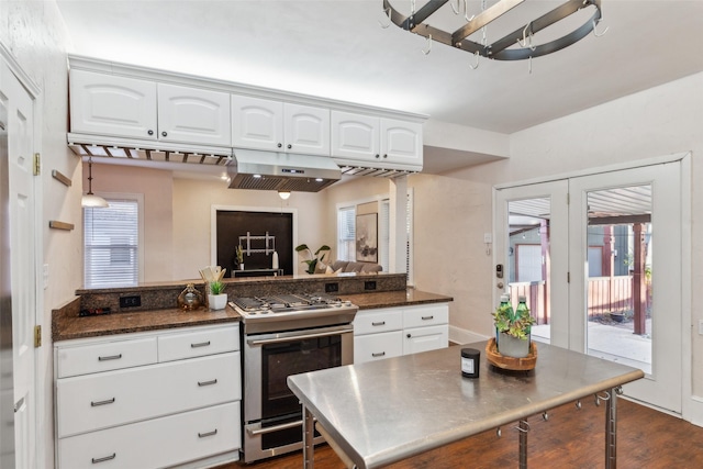 kitchen featuring white cabinets, plenty of natural light, and stainless steel range with gas stovetop