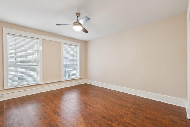 spare room featuring wood-type flooring and ceiling fan