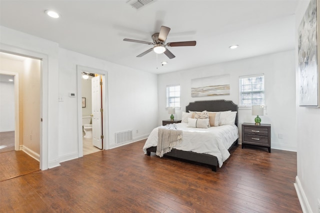 bedroom with dark hardwood / wood-style flooring, multiple windows, and ceiling fan