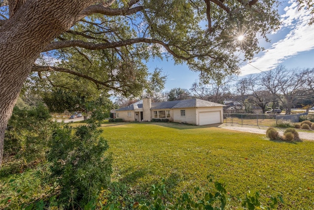 view of yard featuring a garage