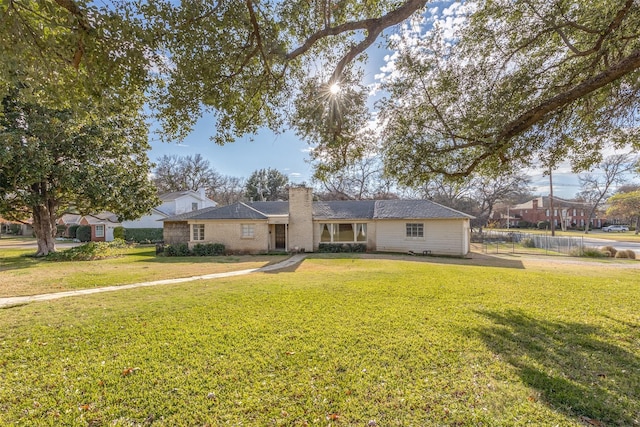 ranch-style house with a front yard
