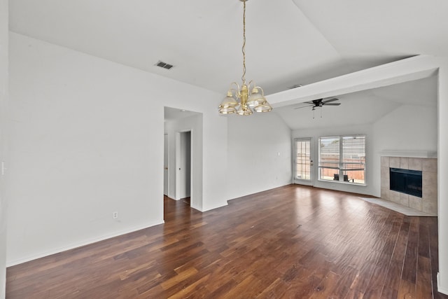 unfurnished living room with lofted ceiling with beams, a fireplace, dark wood-type flooring, and ceiling fan with notable chandelier