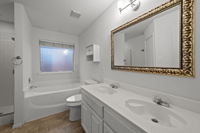 full bathroom featuring vanity, toilet, and independent shower and bath