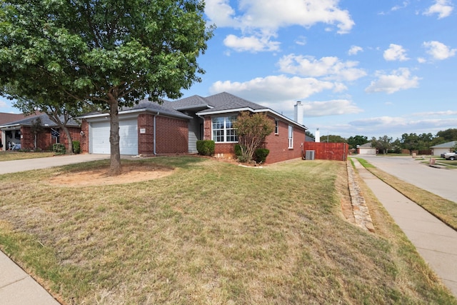 single story home featuring a front yard and a garage