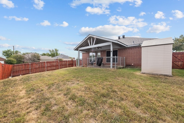 rear view of property with a yard and a patio