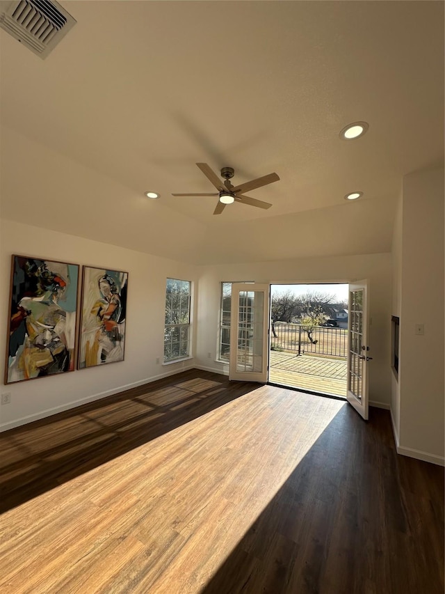 interior space featuring plenty of natural light, ceiling fan, dark hardwood / wood-style flooring, and lofted ceiling