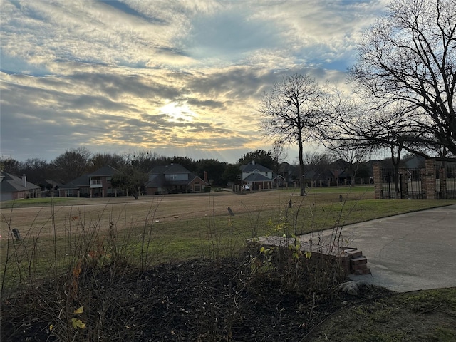 view of yard at dusk