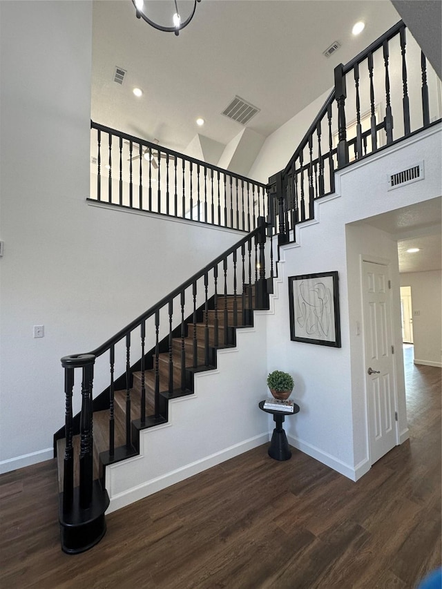 stairs featuring hardwood / wood-style floors