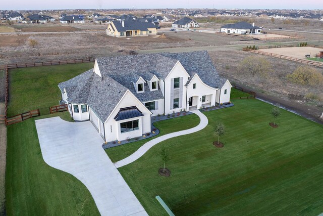 modern farmhouse with a lawn