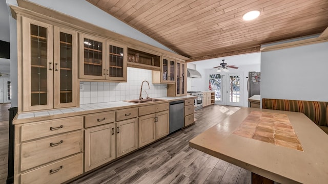 kitchen with french doors, wall chimney range hood, sink, dark hardwood / wood-style floors, and stainless steel appliances