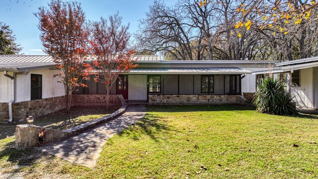 view of front of home with a front yard