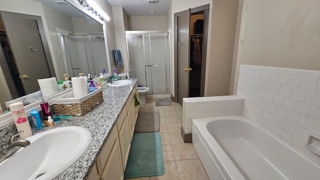 full bathroom with tile patterned flooring, vanity, toilet, and independent shower and bath