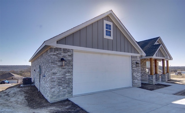 view of front of house with cooling unit and a garage