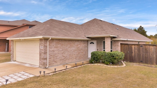 single story home featuring a front yard and a garage