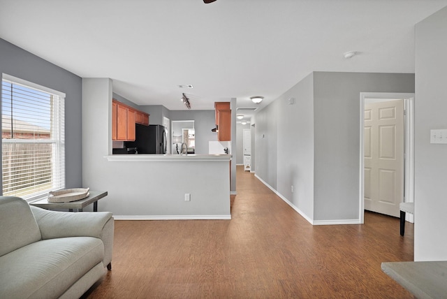 living room featuring sink and hardwood / wood-style floors