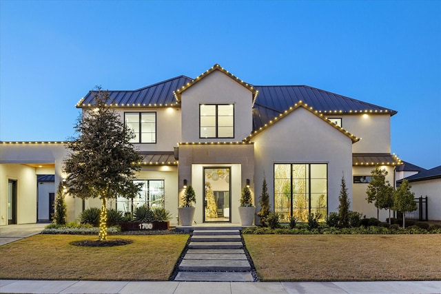 view of front of home with a lawn