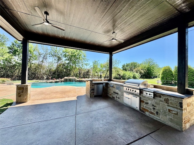 view of patio with an outdoor kitchen, ceiling fan, grilling area, and an outdoor pool