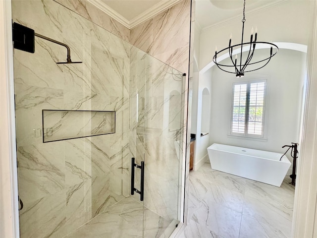 bathroom featuring a chandelier, a marble finish shower, a freestanding bath, marble finish floor, and ornamental molding