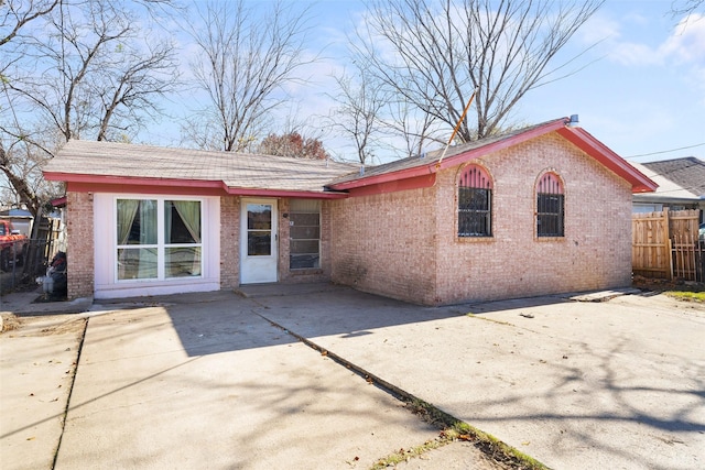 rear view of property featuring a patio area