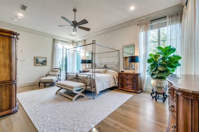 bedroom with ceiling fan and light wood-type flooring