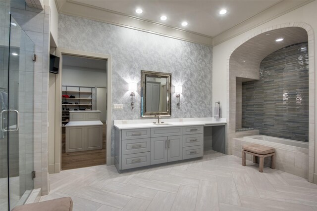 bathroom featuring separate shower and tub, crown molding, and vanity