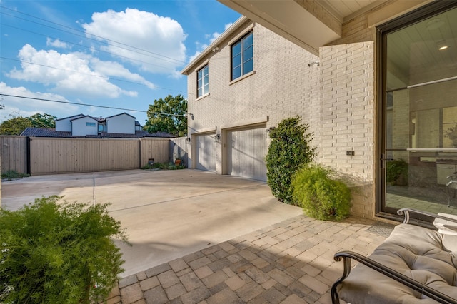 view of patio with a garage