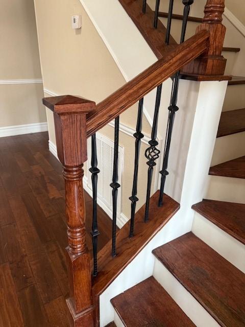 staircase featuring hardwood / wood-style floors