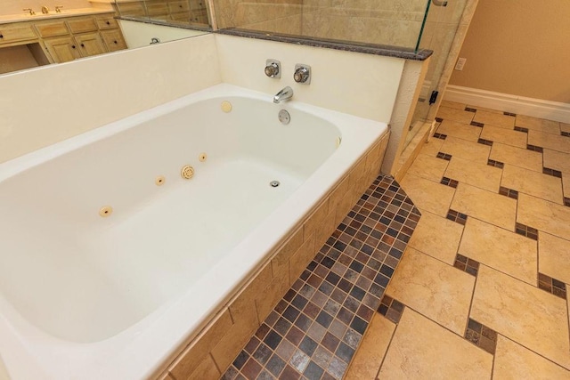 bathroom featuring vanity, shower with separate bathtub, and tile patterned flooring