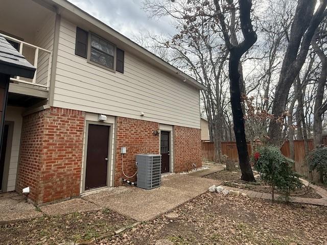 rear view of house with central AC unit