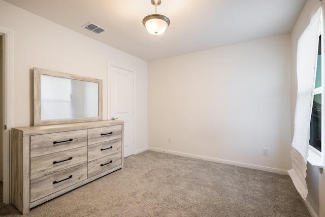 unfurnished bedroom with light carpet