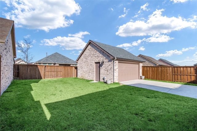 view of yard with a patio area, a garage, and an outdoor structure