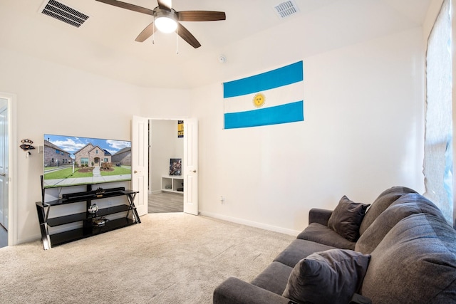 carpeted living room with plenty of natural light and ceiling fan