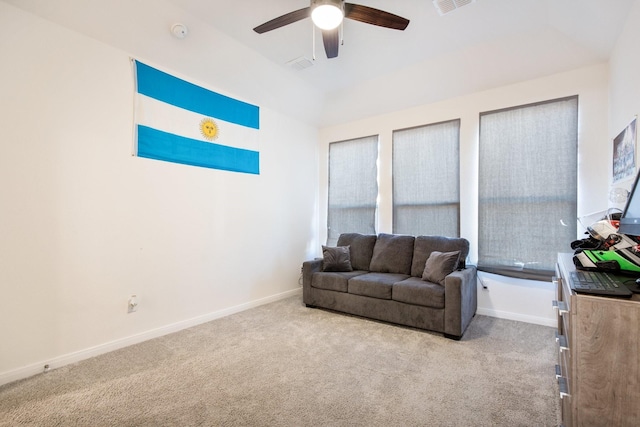 carpeted living room with ceiling fan