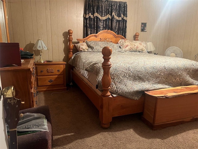 carpeted bedroom featuring wooden walls