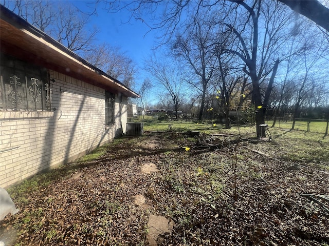 view of yard featuring central AC