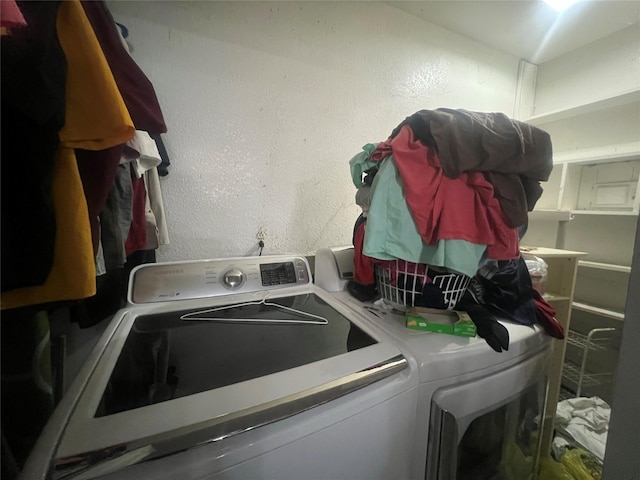 washroom with independent washer and dryer