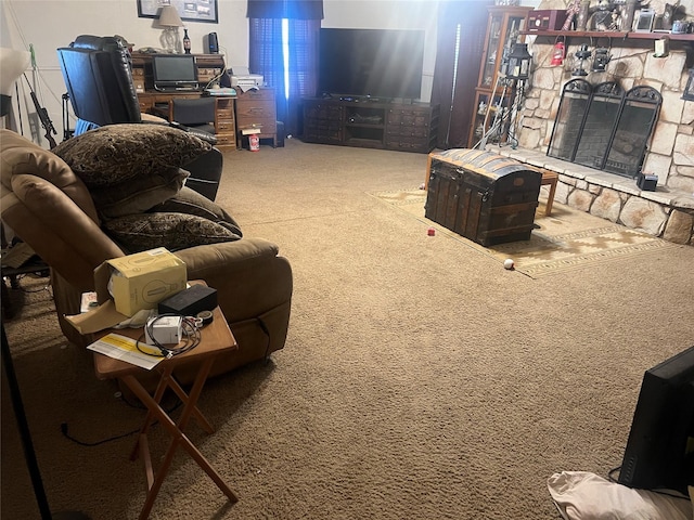 living room with carpet flooring and a stone fireplace