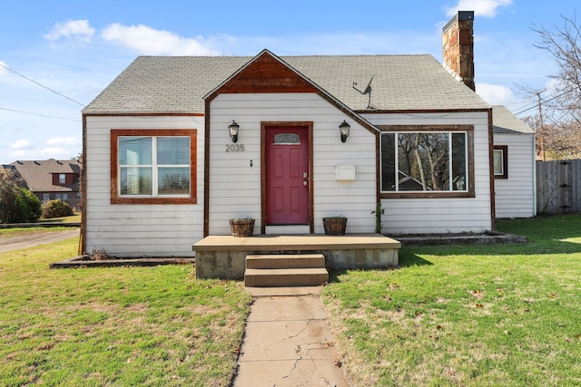 bungalow-style home featuring a front yard