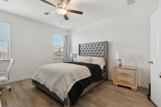 bedroom featuring light hardwood / wood-style floors and ceiling fan