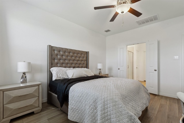 bedroom featuring hardwood / wood-style flooring and ceiling fan