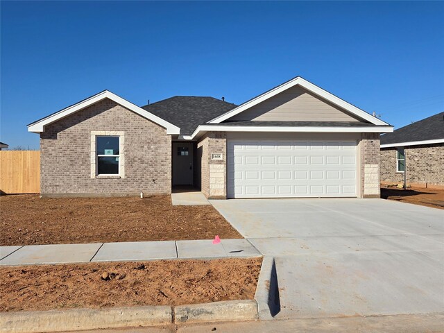 single story home featuring a garage