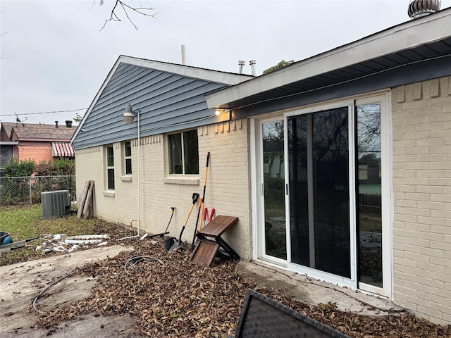 rear view of property with cooling unit