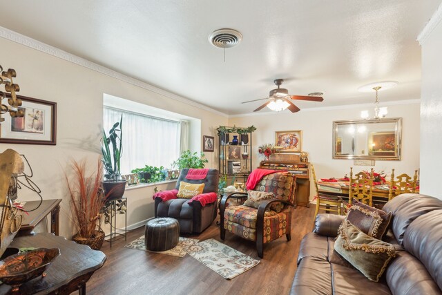 living room featuring crown molding, ceiling fan, and wood-type flooring