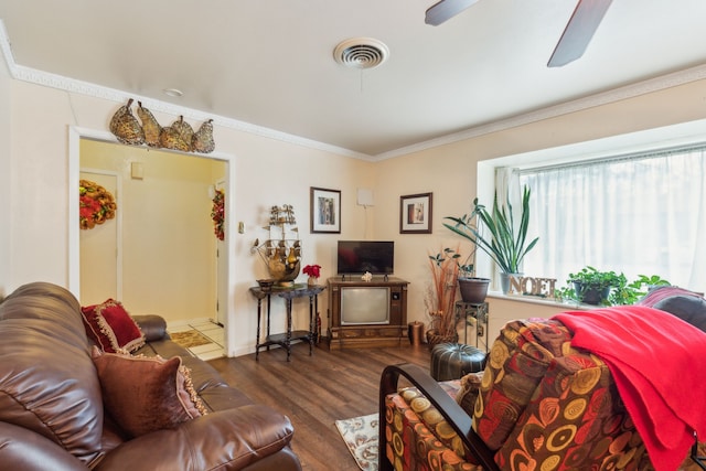 living room featuring ceiling fan, dark hardwood / wood-style floors, and ornamental molding