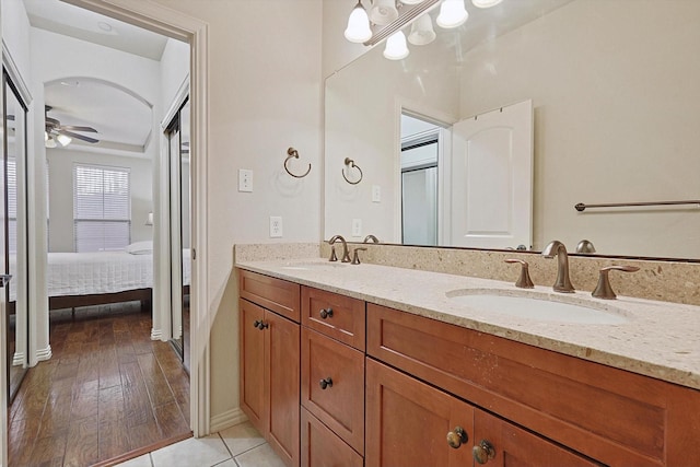 bathroom featuring vanity, tile patterned flooring, and ceiling fan