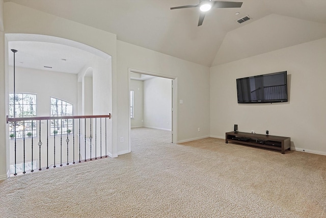 living room with ceiling fan, light colored carpet, and lofted ceiling