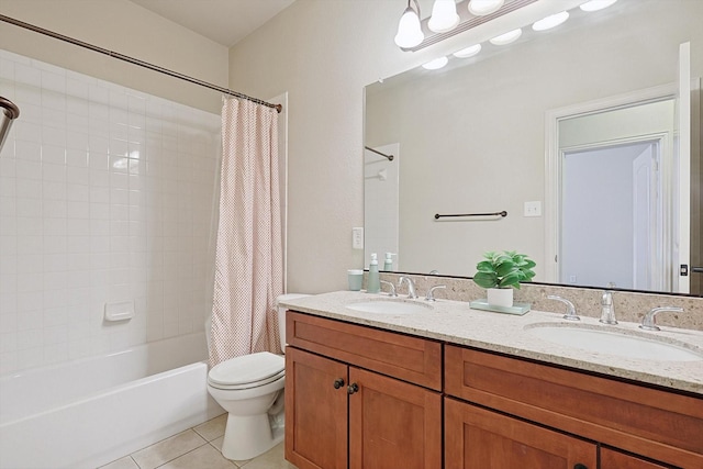 full bath featuring shower / bath combo, a sink, toilet, and tile patterned floors