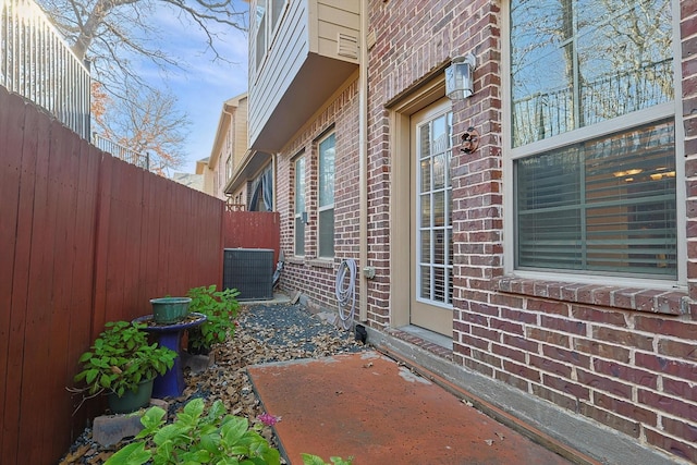 view of side of property featuring central air condition unit