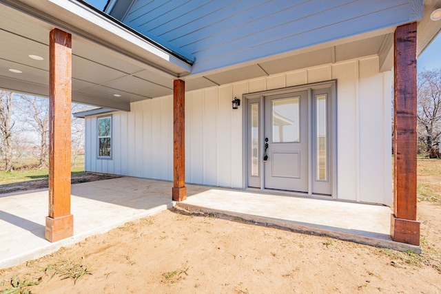 property entrance featuring a patio area