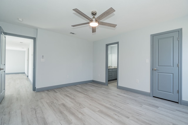 spare room with light hardwood / wood-style flooring and ceiling fan